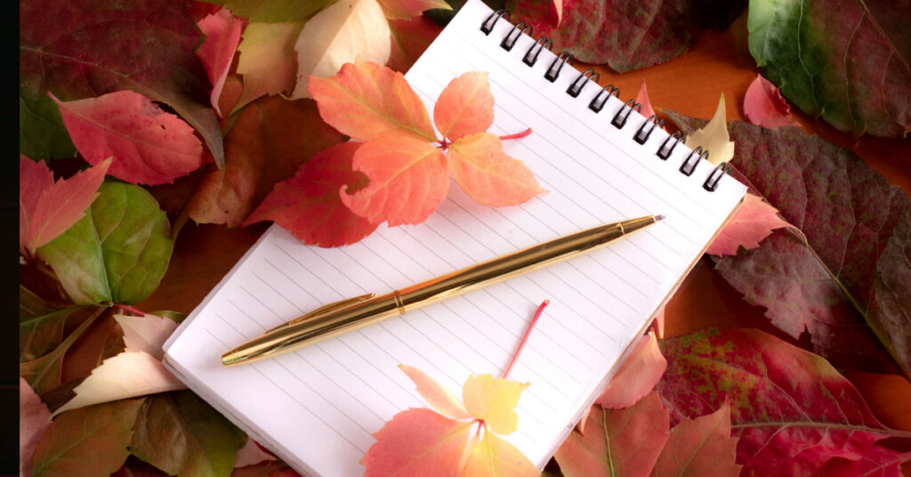 Writing gratitude in a journal to start the day positively